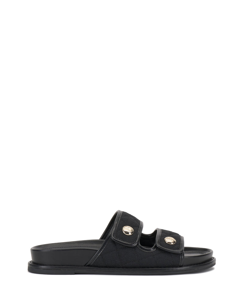 The Graysin Slide by Vince Camuto is a black sandal with a quilted upper, two wide double straps topped with gold-toned buttons, plus an open toe and flat sole.