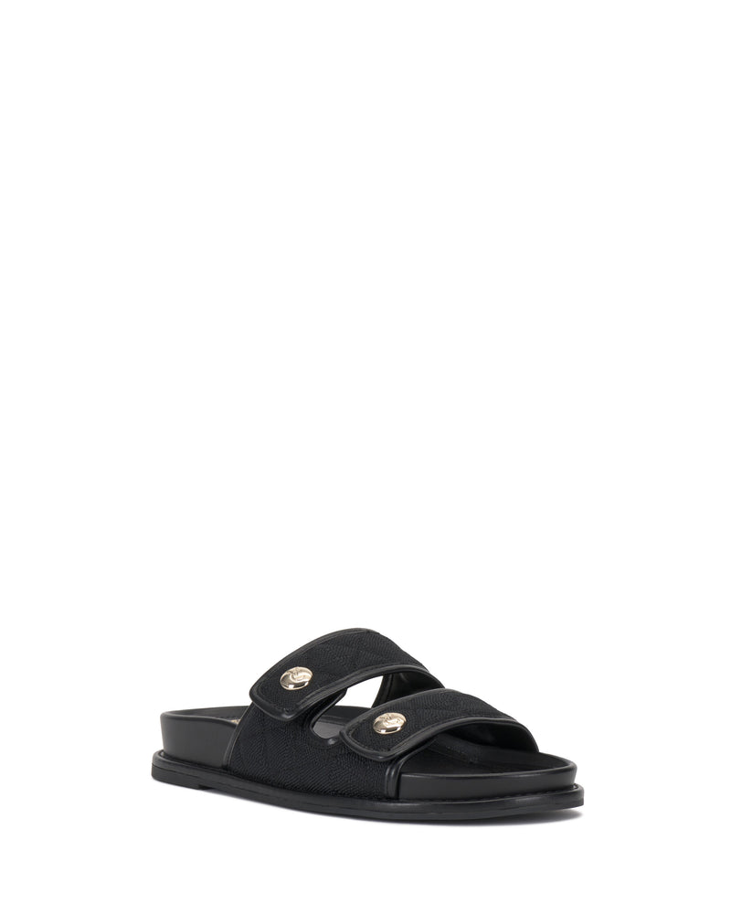 The Vince Camuto Graysin Slide is a black sandal featuring double quilted straps, each accented with a round gold button, displayed on a plain white background.