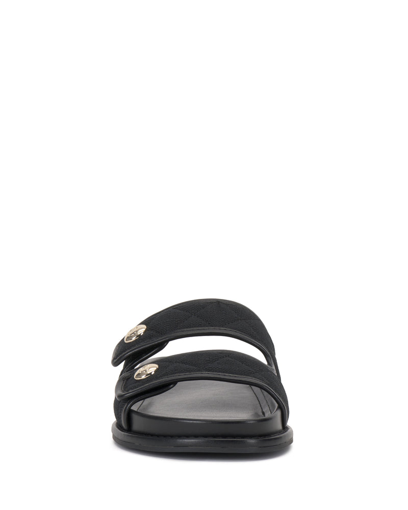 Front view of the Graysin Slide by Vince Camuto: a black double strap sandal with a quilted upper, each strap adorned with subtle gold-toned buttons and a small metallic logo detail, finished with a flat sole.