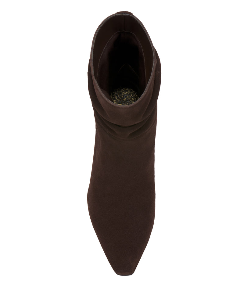 A top view of the Vince Camuto Grenna Slouchy Bootie in brown suede is shown on a white background, featuring a pointed toe, slouched design around the ankle, and a dark inner lining.