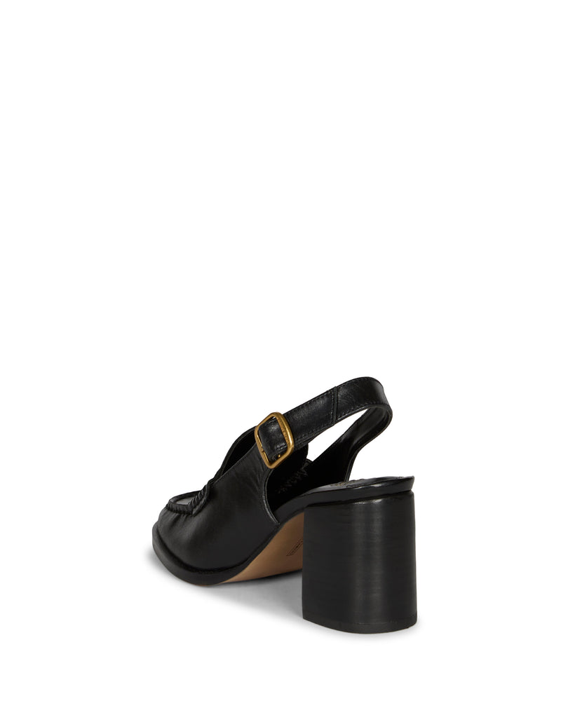 The Grinie Loafer by Vince Camuto is a black heeled slingback with a chunky block heel, loafer-inspired style, gold buckle on the side strap, and a slightly pointed toe, shown from the back against a white background.