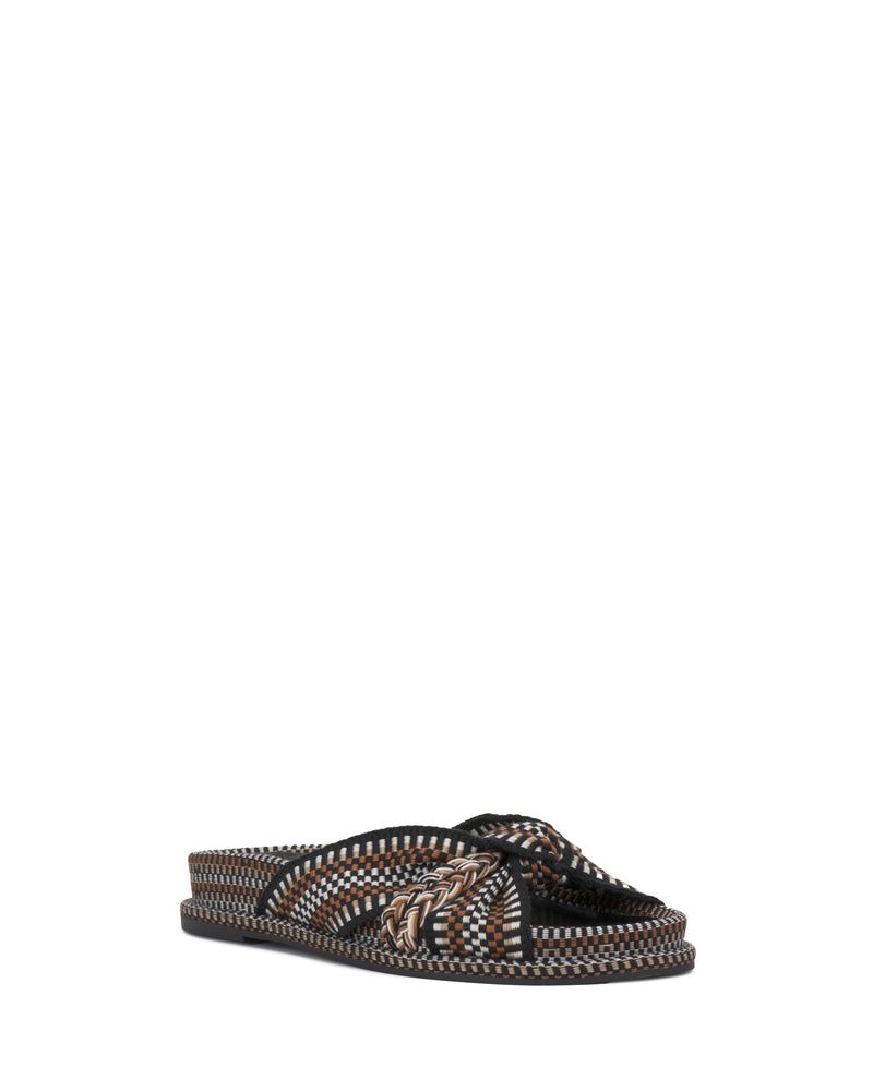 The Vince Camuto Gryfynn Slide features a flat, cushioned sole and a crisscross upper with black, brown, and beige braided details. Styled for comfort and elegance, it's shown against a plain white background.