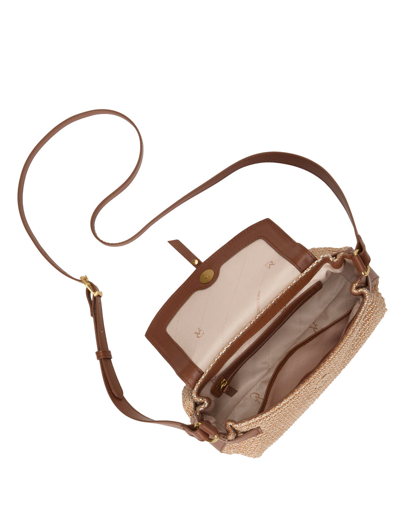 A top view of the Vince Camuto Hadley Crossbody Bag highlights its everyday style with a long brown strap, tan woven exterior, brown leather trim, and beige fabric interior featuring zip and open pockets.