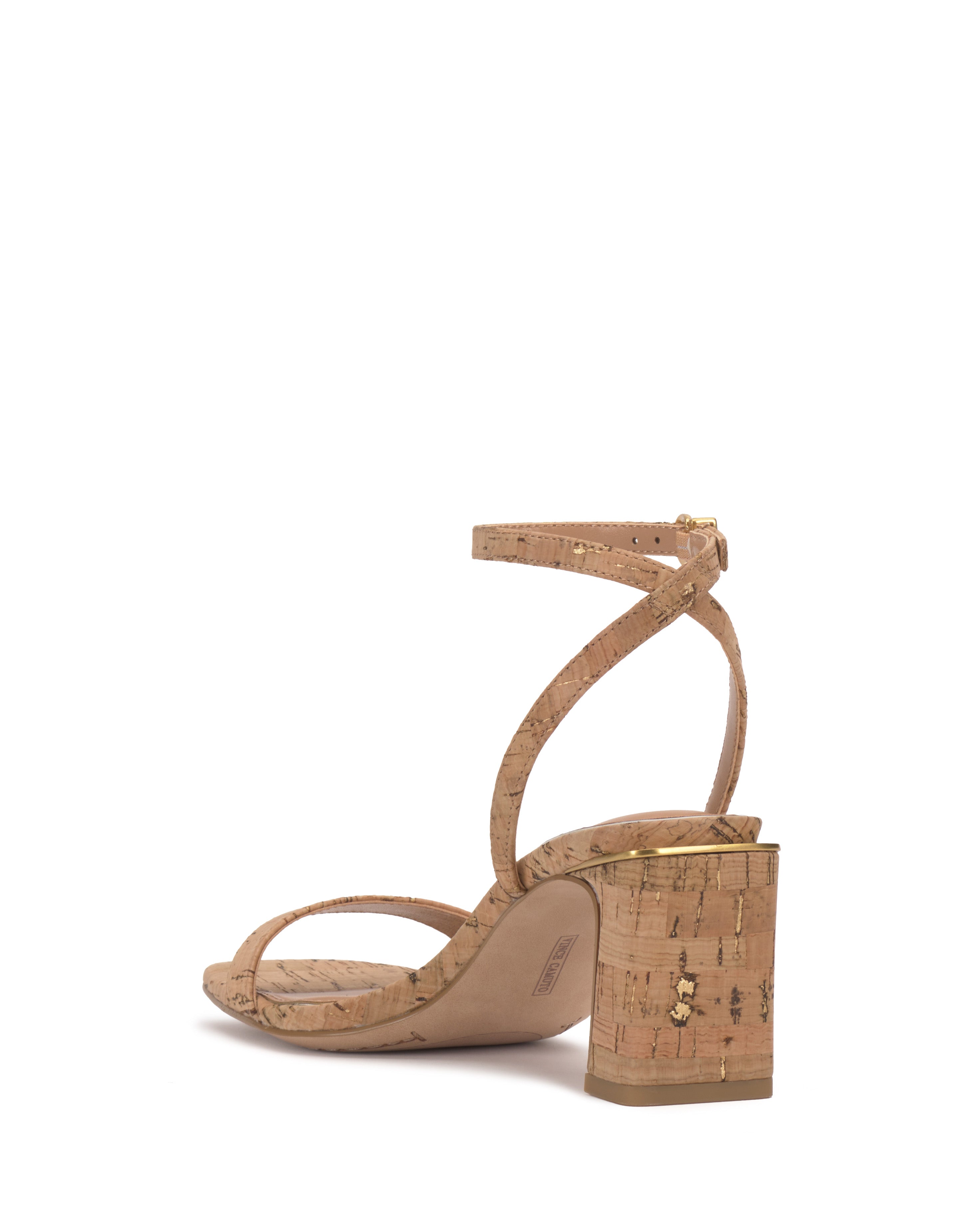 The Hamda Sandal by Vince Camuto features a cork-textured, open-toe block heel with a minimalist design and an adjustable ankle strap with a gold buckle, shown at an angle to highlight the heel and side view.