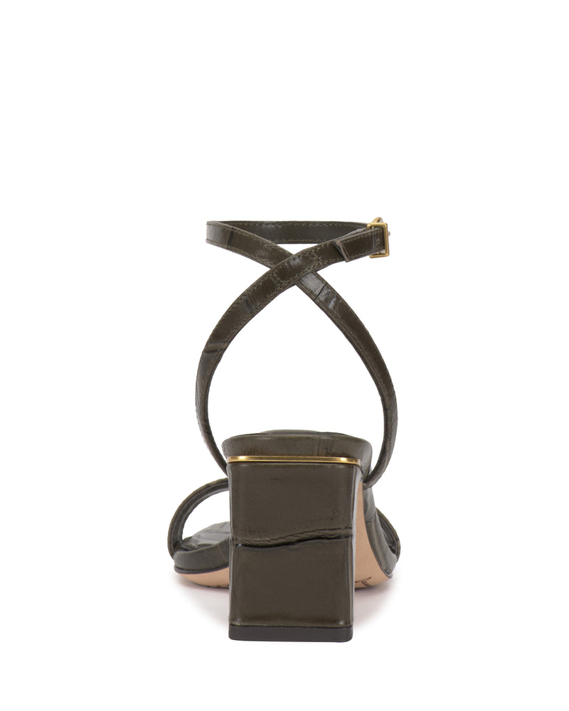 Vince Camuto Hamda olive green minimalist block-heel sandal with an adjustable ankle strap and gold-tone buckle.