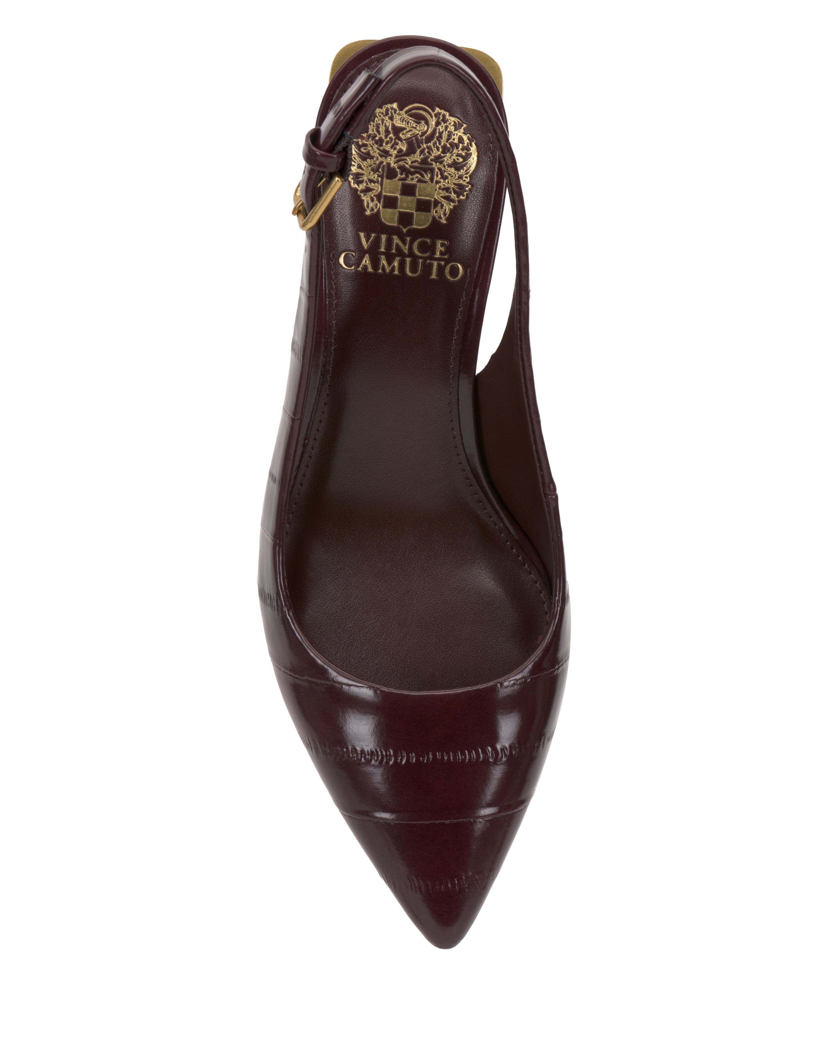 A top view of the Vince Camuto Hamden Buckle Slingback, a dark burgundy pointed-toe shoe featuring a textured pattern, gold branding, and a decorative emblem on the insole.