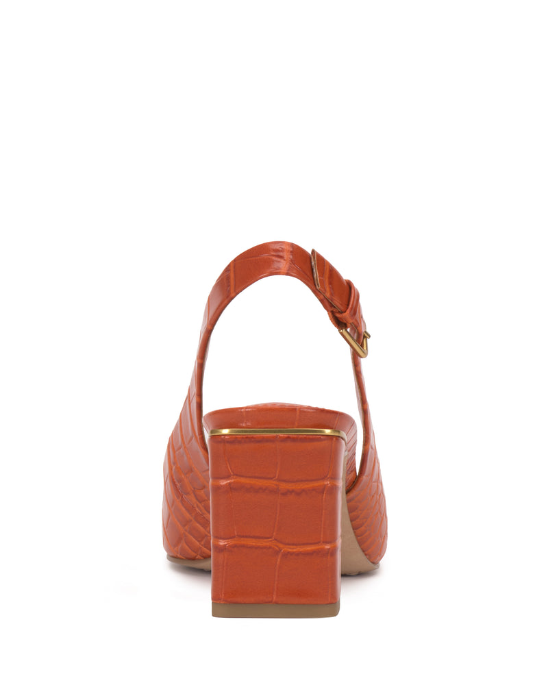 Rear view of an orange Hamden Buckle Slingback by Vince Camuto, showcasing a crocodile-textured finish, block heel, and slingback strap with a gold buckle, displayed on a white background.