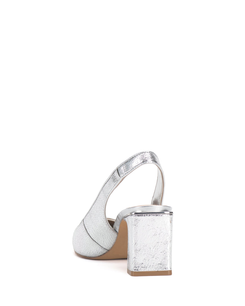 The Vince Camuto Hamden Slingback, shown from the back against a white background, features a silver finish with a sleek slingback strap and a textured block heel.