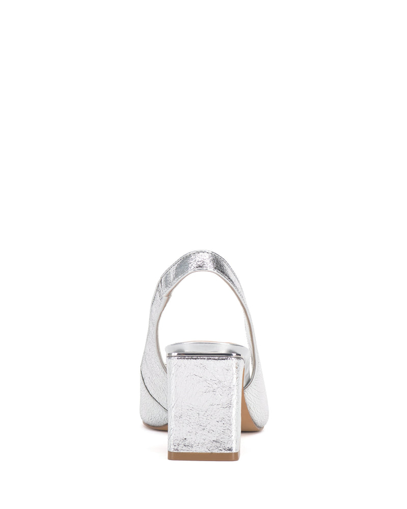 The Vince Camuto Hamden Slingback, a silver textured block-heeled shoe with a leather slingback strap, is displayed from the back against a plain white background.