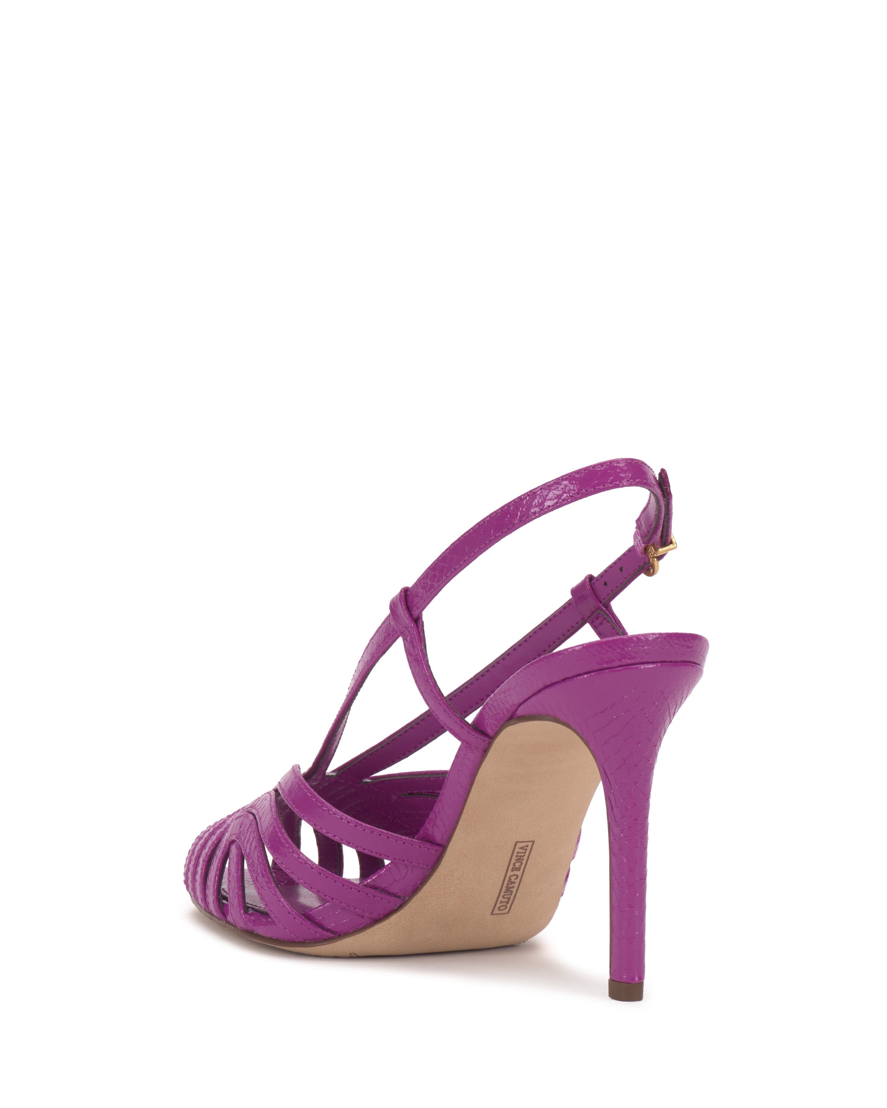 The Vince Camuto Hannie Slingback Sandal is shown in vibrant purple with a strappy caged design, open toe, adjustable ankle strap, slim medium-high heel, and beige insole—all photographed against a white background.