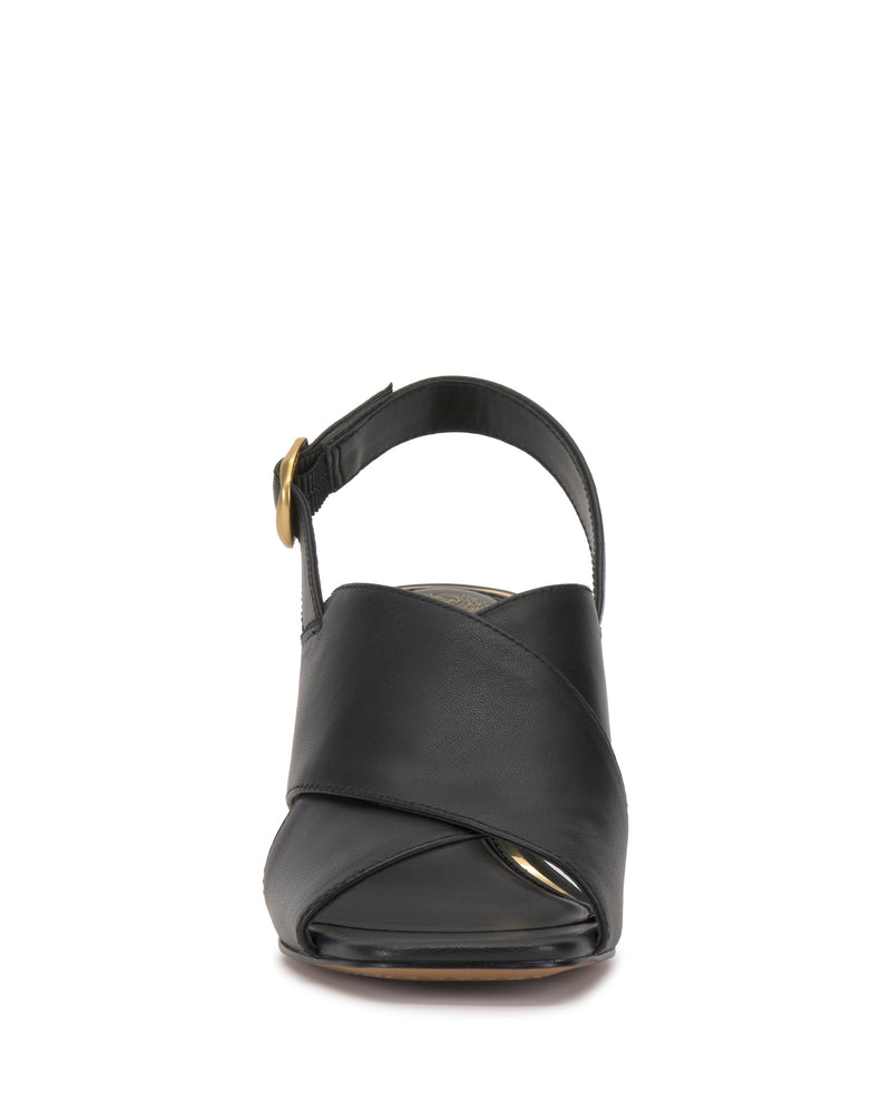 Front view of the Vince Camuto Harlynn Sandal in black, showcasing open-toe crisscross leather straps and an ankle strap with a gold buckle.