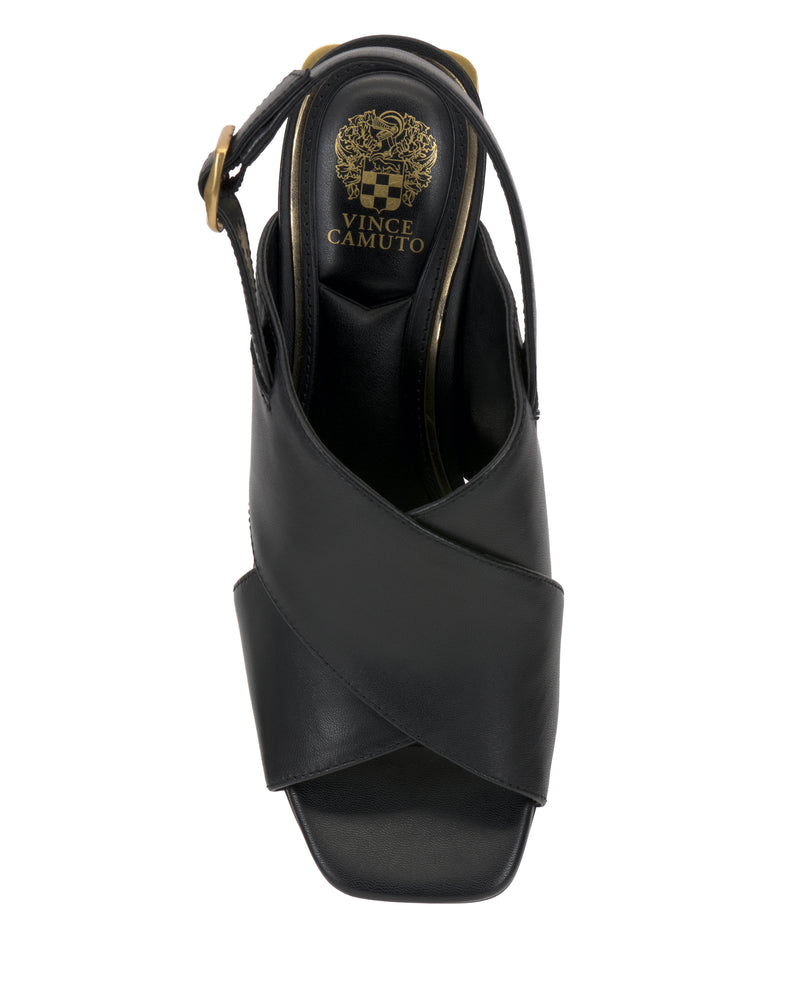 The Vince Camuto Harlynn Sandal in black features wide crisscross straps, a slingback strap, a square open toe, and displays a gold logo on the insole when viewed from above.