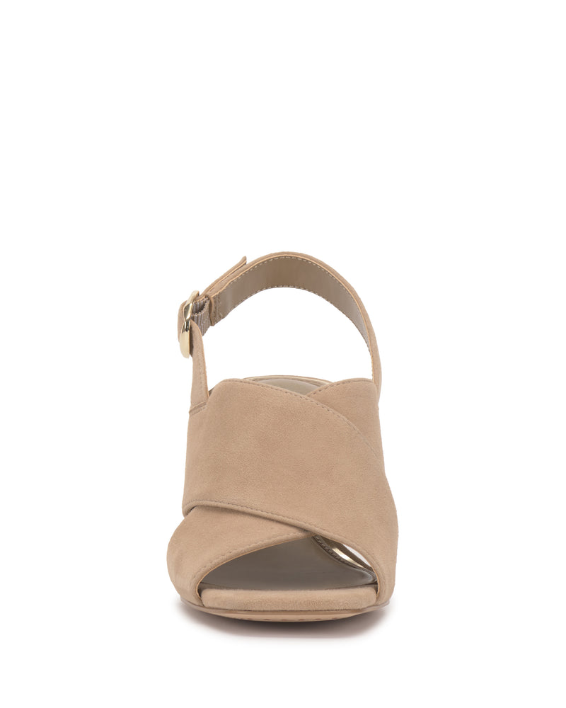 Front view of the Vince Camuto Harlynn Sandal in beige, showcasing an open toe with crisscross suede straps and a slender ankle strap with a small buckle, all set atop a chic block heel.