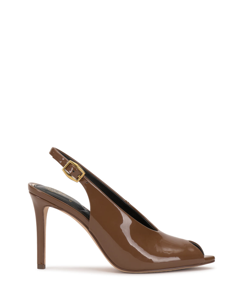 The Vince Camuto Helenza Pump is crafted from brown patent leather with a skinny heel and an open peep toe, accented by a gold buckle detail. Displayed in profile against a white background.