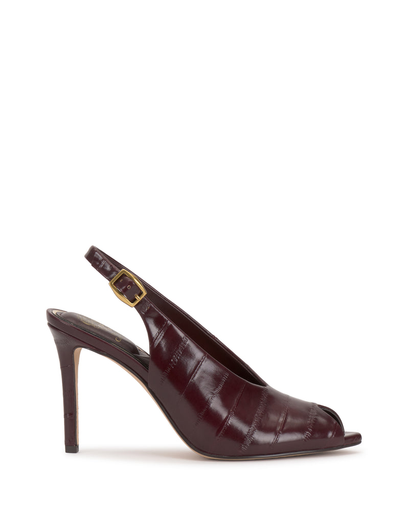 The Vince Camuto Helenza Pump is a burgundy slingback heel featuring a peep toe, gold buckle, and a sleek, glossy finish. Shown in profile on a white background, these stylish heels are elevated by a classic skinny heel for an elegant touch.