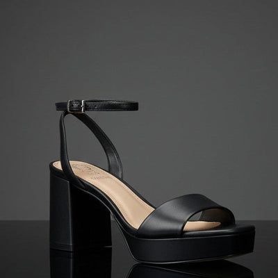Pendreya Platform Sandal in Black under a darklight background