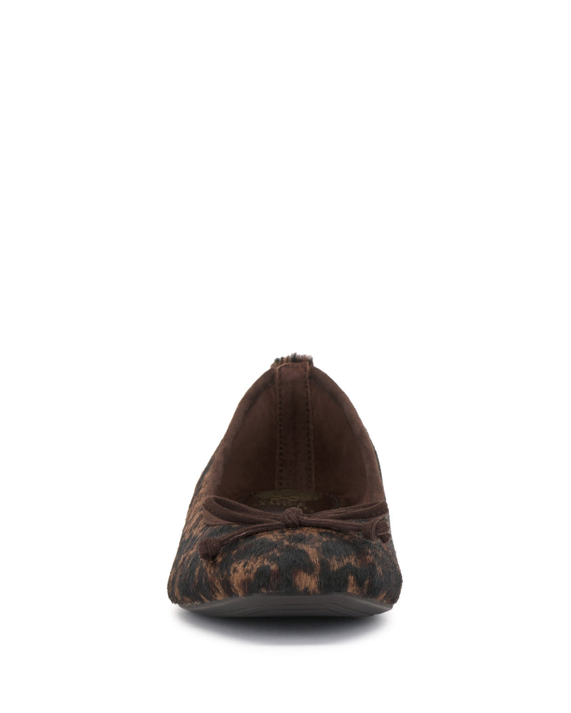 Front view of the Vince Camuto Jenlea Ballet Flat, a women’s flat shoe with a brown and black leopard print pattern, featuring a small bow detail on the toe and a rounded front.
