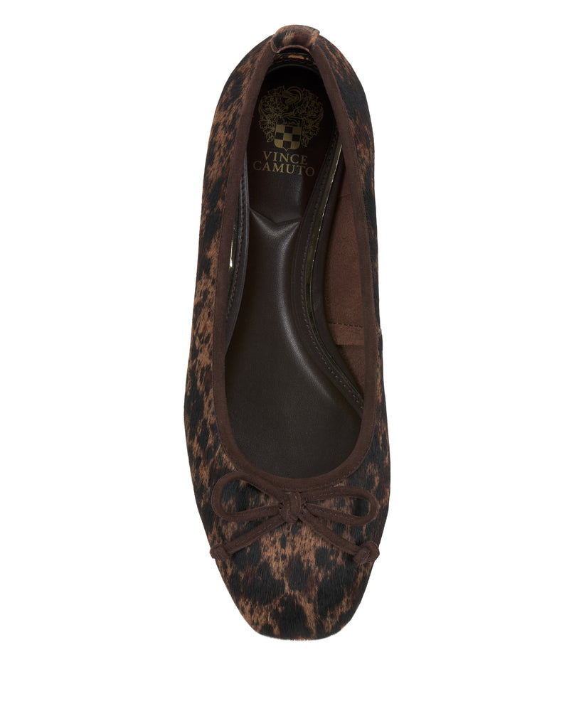 Top view of the Jenlea Ballet Flat by Vince Camuto, featuring a brown and black leopard print, a bow detail at the toe, and the Vince Camuto logo on the insole.