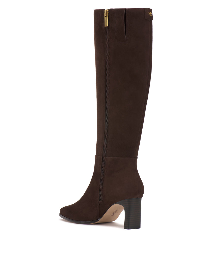 The Jorela Narrow Calf Knee High Boot by Vince Camuto is a tall brown suede boot with a side zipper, round toe, stacked block heel, and a small gold logo detail near the top.