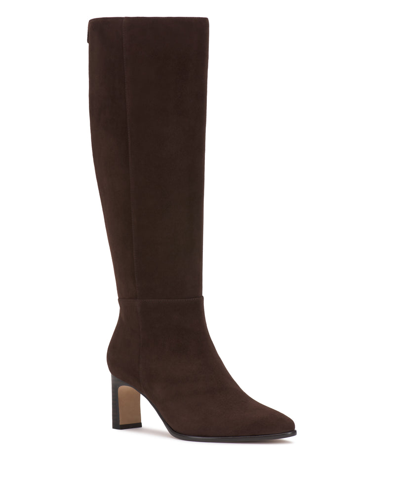 The Vince Camuto Jorela Knee High Boot is a tall, dark brown suede boot featuring a block heel and an almond-shaped toe, displayed against a white background.