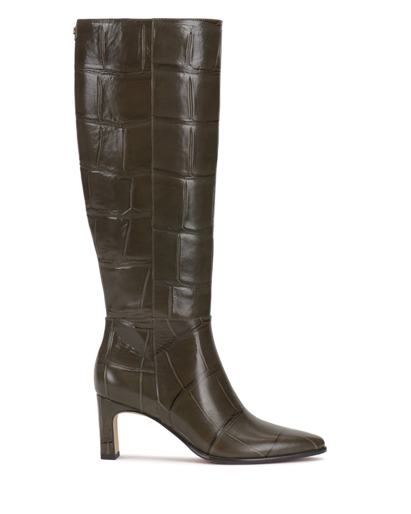 The Vince Camuto Jorela Knee High Boot is a tall, dark green leather boot featuring a block heel and a textured crocodile-style pattern, displayed from the side against a white background.