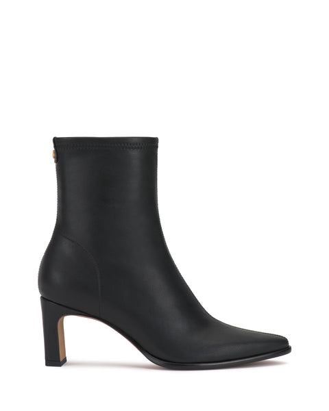 The Vince Camuto Julea Bootie is a black leather ankle boot featuring a pointed toe, mid-height block heel, and a small gold button accent near the top of the shaft, displayed in side profile against a white background.