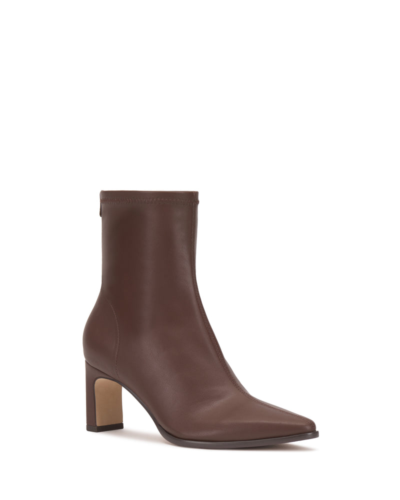 The Julea Bootie by Vince Camuto is a brown leather ankle boot featuring a pointed toe and a high block heel, shown against a plain white background.