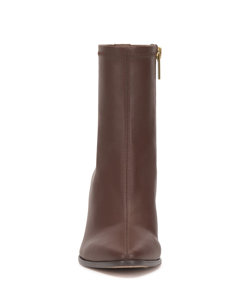 Front view of the Vince Camuto Julea Bootie, a brown leather ankle boot featuring a gold side zipper, displayed on a plain white background.