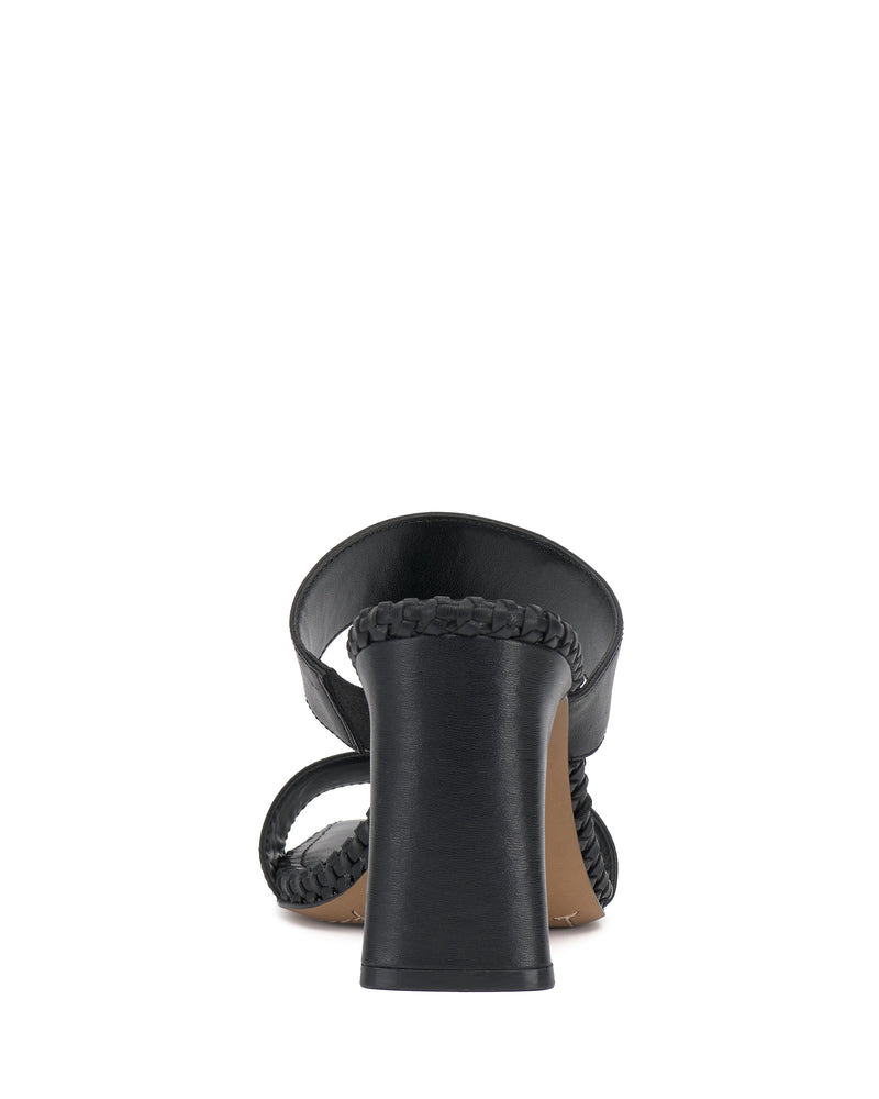 Rear view of the Vince Camuto Kaden Mule, a black sandal with a thick block heel and braided straps, set against a white background for a chic, boho-inspired vibe.