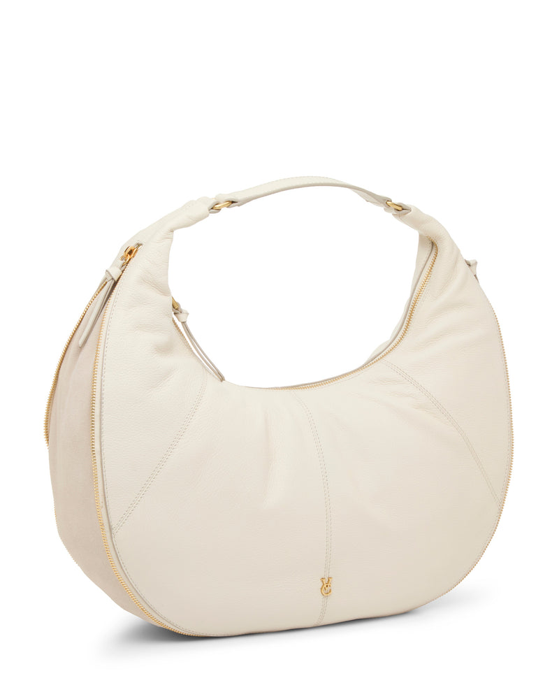 The Vince Camuto Kaela Hobo Bag features white leather, a crescent silhouette, single top handle, and gold-tone zipper and hardware—offering chic versatility for any occasion against a minimalist white backdrop.