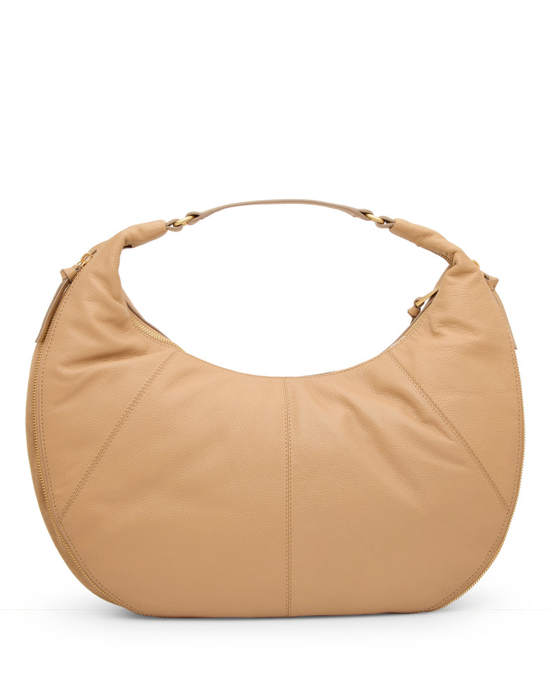 The Vince Camuto Kaela Hobo Bag features a large, crescent shape in tan leather with a short, sturdy handle and subtle stitching, shown against a white background.