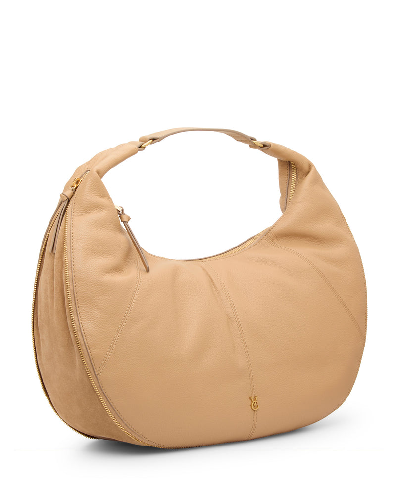 The Vince Camuto Kaela Hobo Bag is beige, crescent-shaped, and features a short handle, gold zipper, and small gold logo near the bottom. This stylish shoulder bag stands upright on a white background.