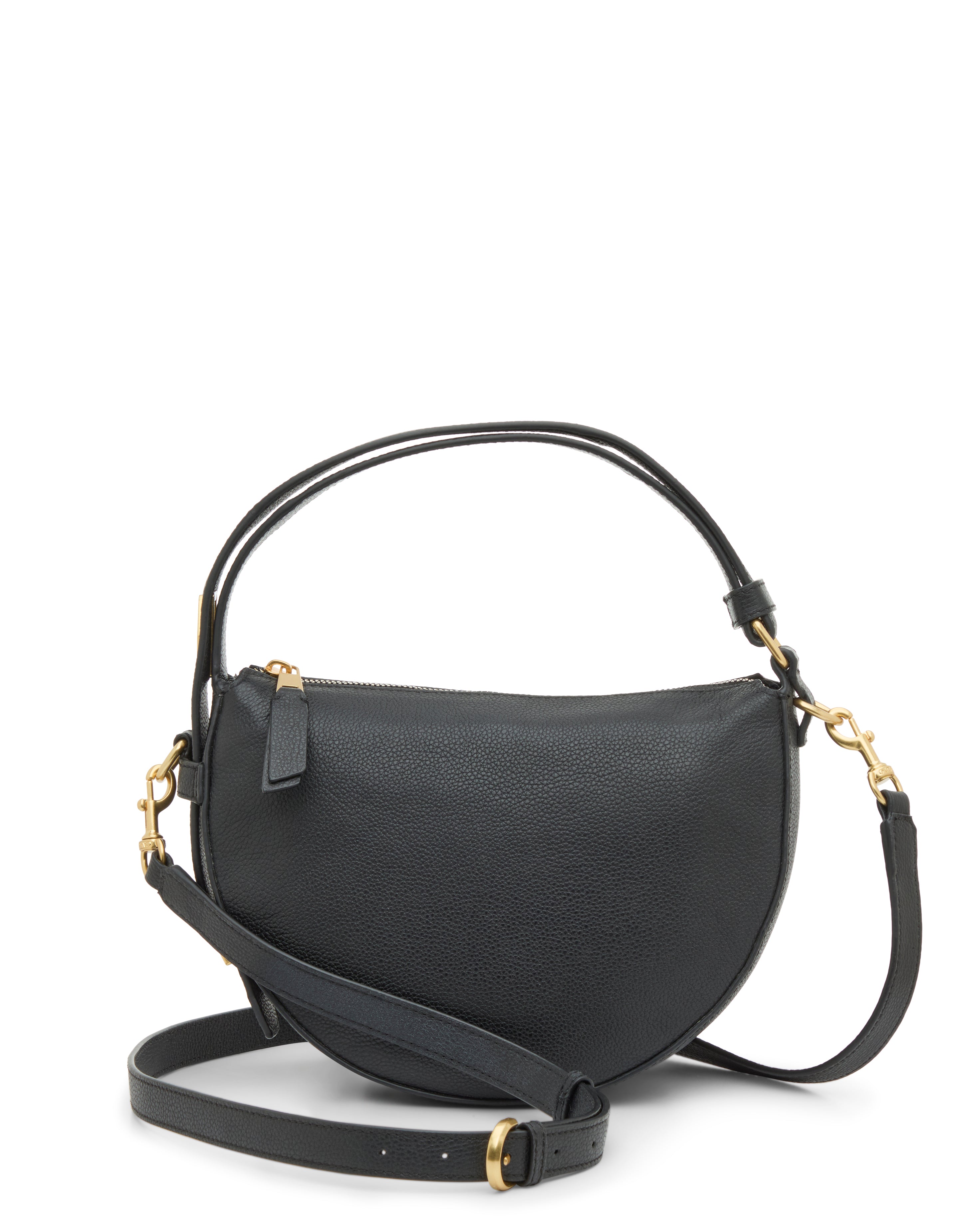 The Vince Camuto Karla Crossbody Bag features a black, half-moon leather design with gold hardware, a zip closure, a short handle, and an adjustable shoulder strap attached by gold rings.