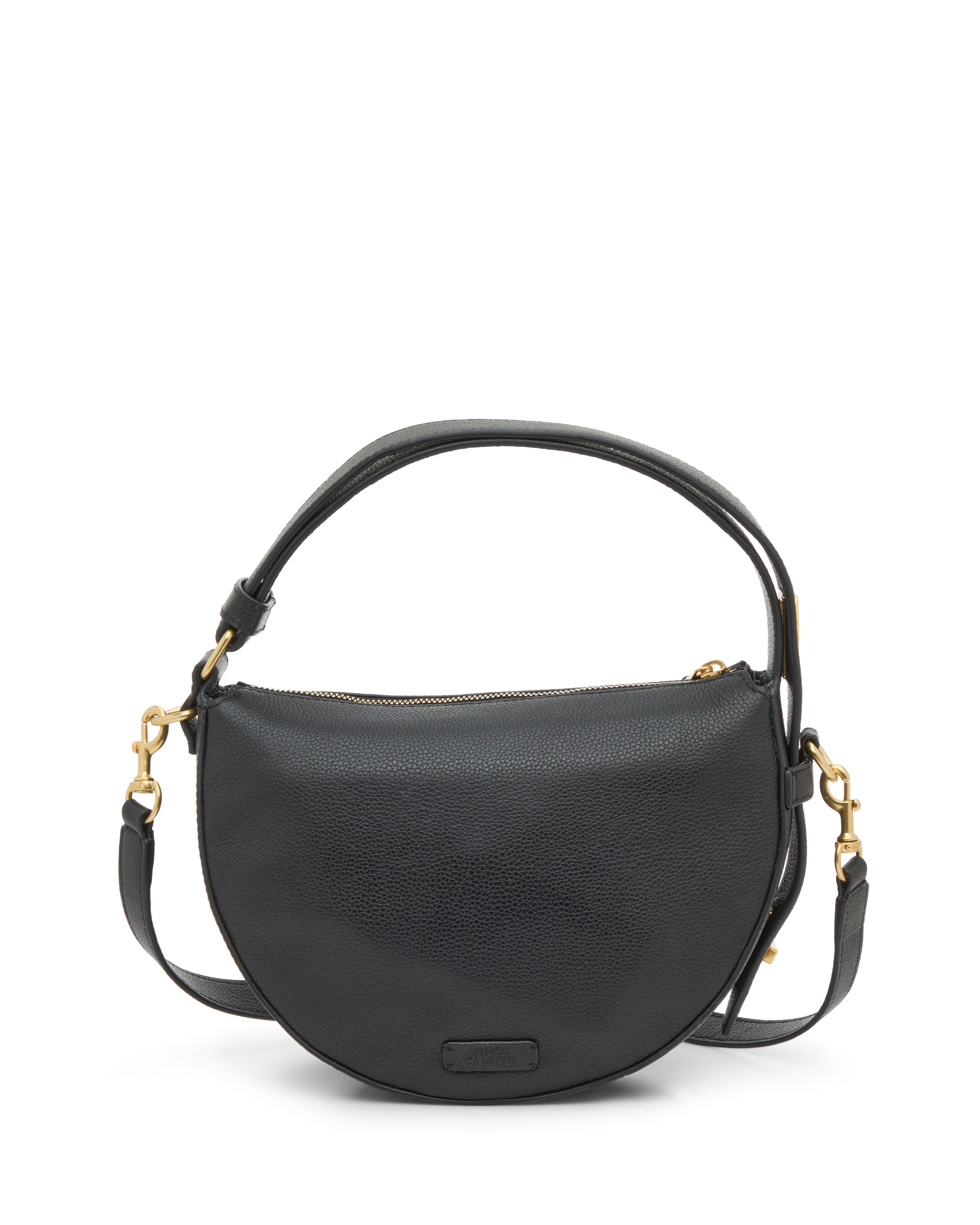 The Vince Camuto Karla Crossbody Bag is a sleek black leather half-moon design with gold-tone hardware, a short handle, and a detachable adjustable shoulder strap, pictured on a white background.