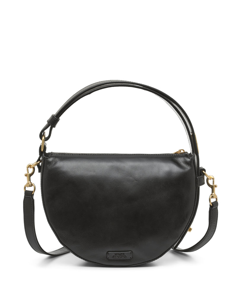 A black leather Vince Camuto Karla Crossbody Bag with gold hardware features a half-moon shape, a curved bottom, top handle, and detachable crossbody strap, set against a white background.
