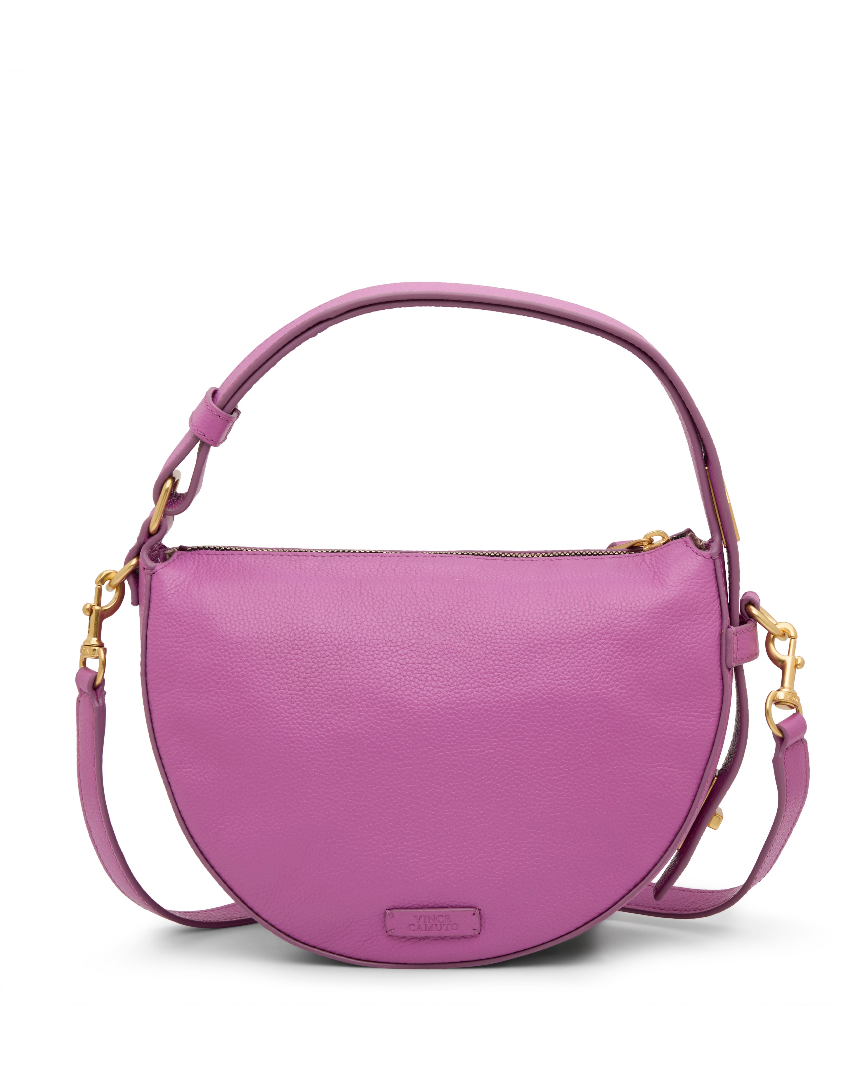 The Vince Camuto Karla Crossbody Bag is round, lavender leather with a short handle, detachable long strap, gold-tone hardware, and a small embossed logo on the lower front.