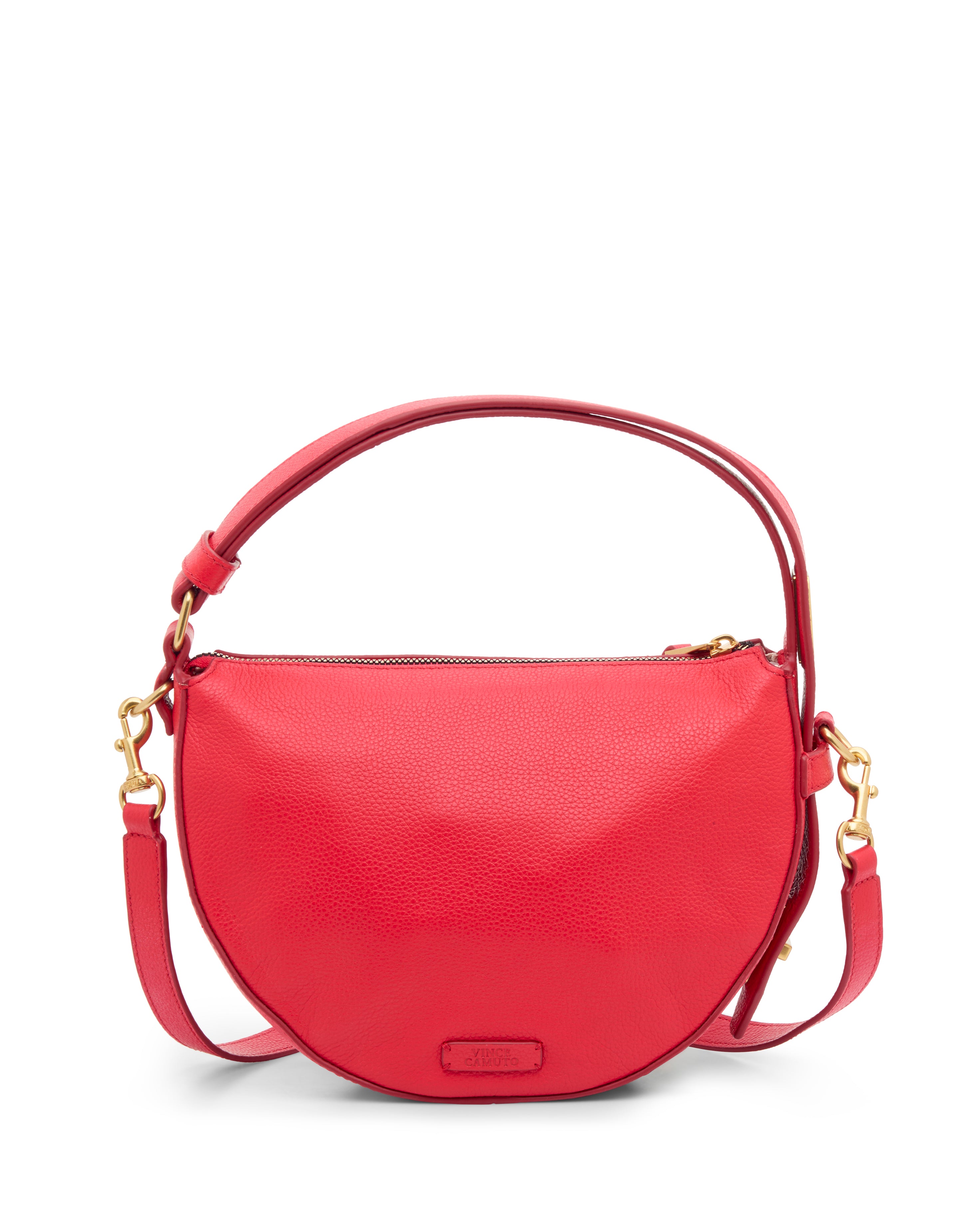 The Karla Crossbody Bag by Vince Camuto is a bright red, half-moon shaped leather handbag featuring a top handle, gold hardware, an adjustable crossbody strap, and a simple, elegant design with a zipper closure.