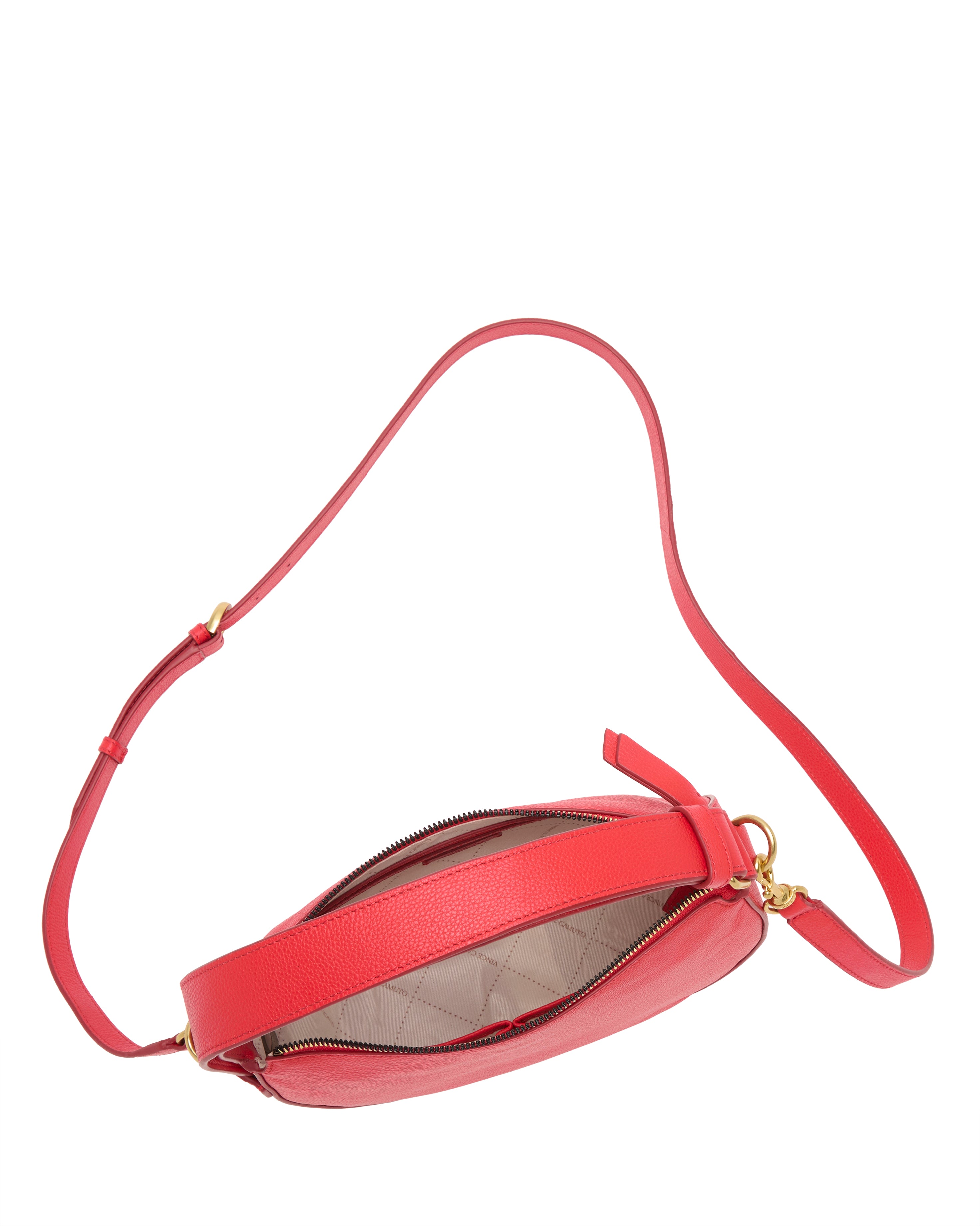 The Vince Camuto Karla Crossbody Bag features red leather, a gold zipper, and an adjustable strap. Its open design reveals a light beige lining with a subtle quilted pattern.