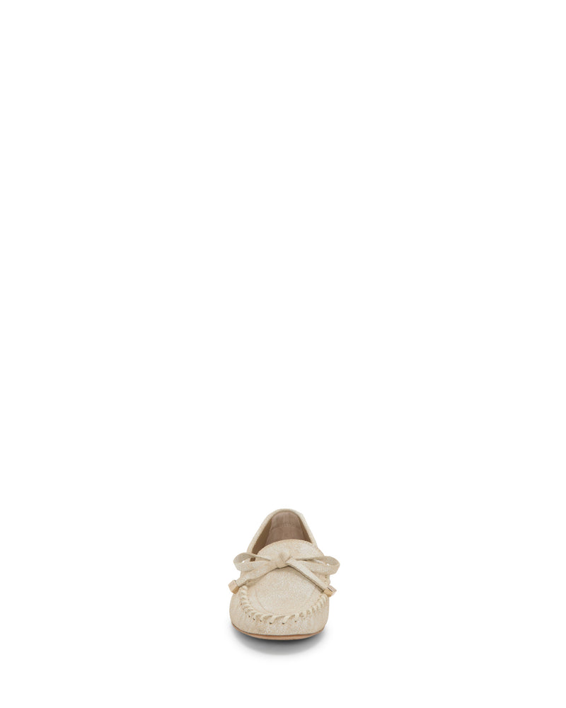 The Vince Camuto Katena Flat Loafer in beige, shown from the front against a white background, features a bow accent and a lightweight moc-inspired silhouette.