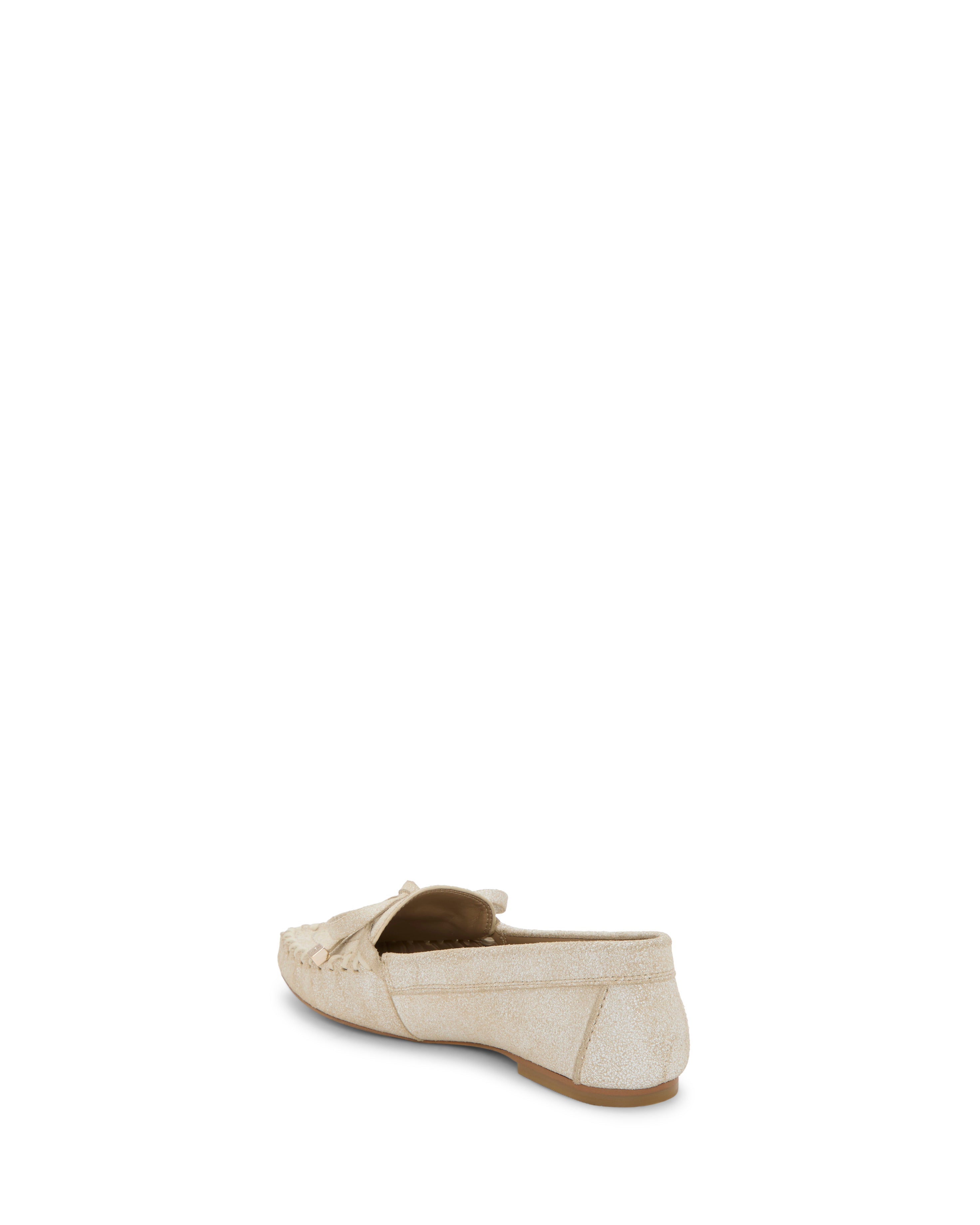 The Vince Camuto Katena Flat Loafer is a beige suede shoe with a moc-inspired silhouette and a small bow on top, shown from the back against a white background.