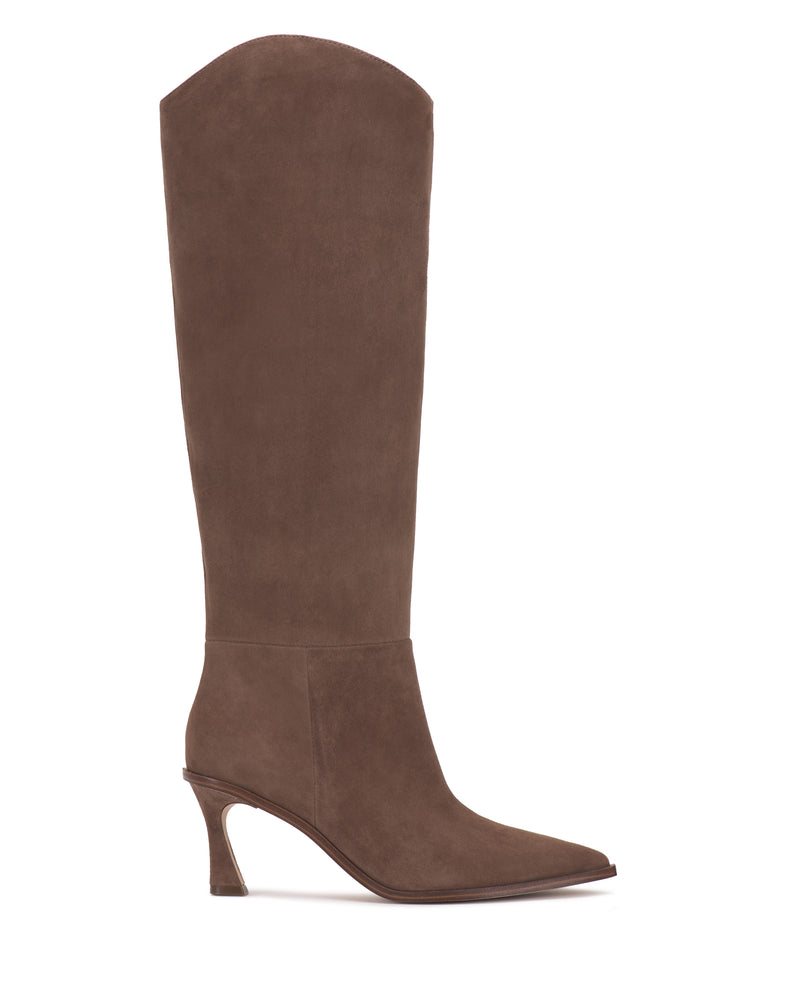 The Kenlea Narrow Calf Knee High Boot by Vince Camuto is a tall, brown suede boot featuring a pointed toe, high curved heel, smooth finish, and a slightly slouched shaft that rises to just below the knee.
