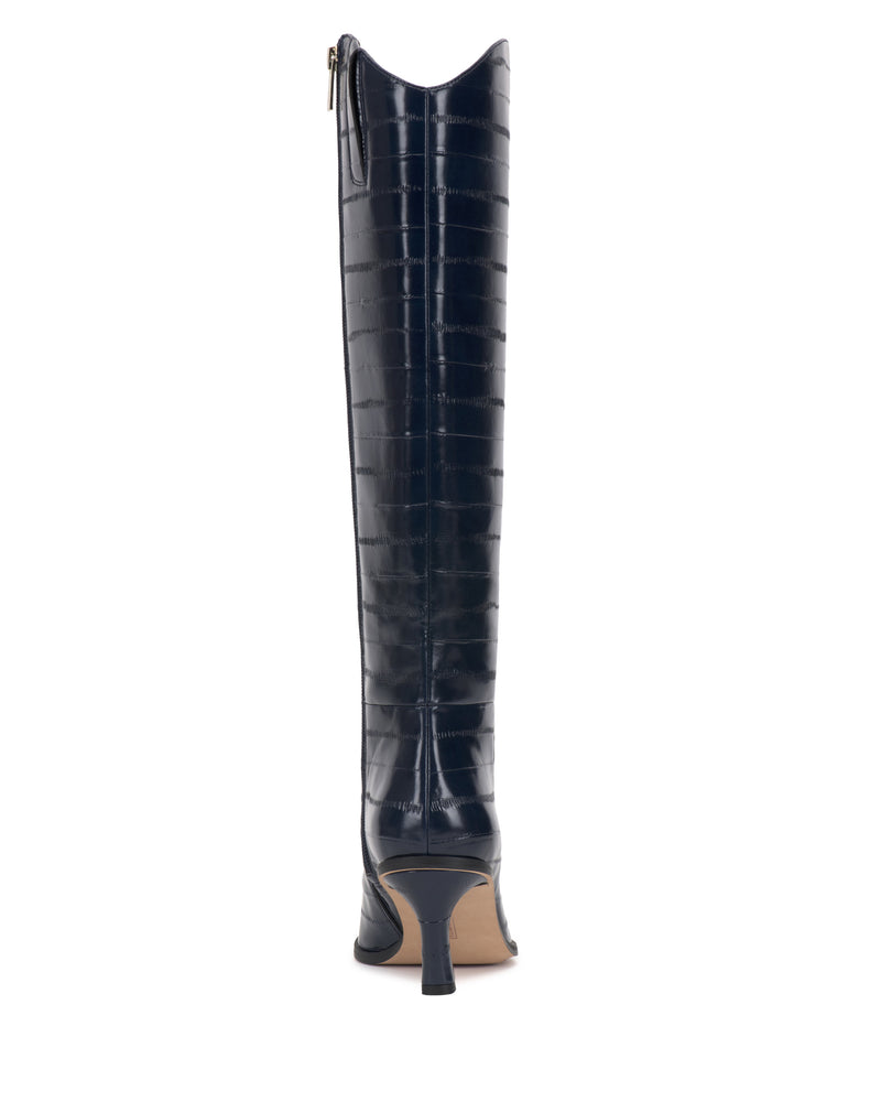 Kenlea Narrow Calf Knee High Boot by Vince Camuto in navy blue croc-embossed leather, featuring a stiletto heel and gold back zipper, shown from the rear angle on a white background.