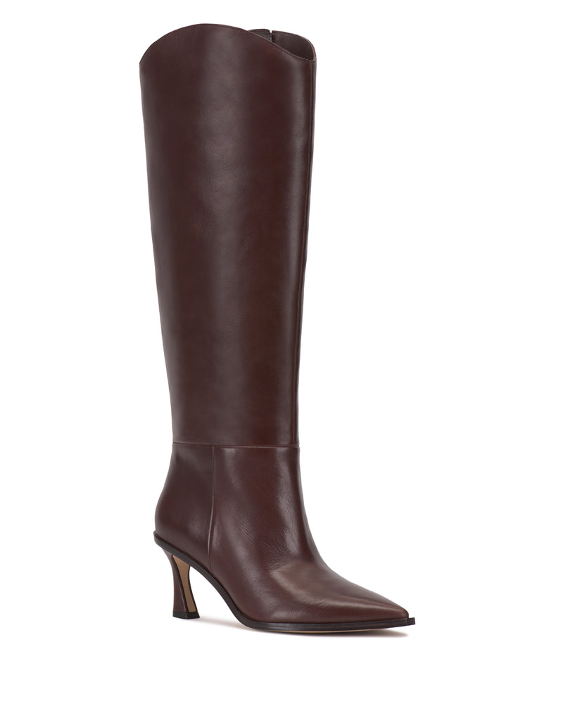 The Kenlea Knee High Boot by Vince Camuto showcases a tall silhouette crafted from dark brown leather, with a pointed toe, mid-height angled heel, sleek smooth finish, and a slightly curved top edge.