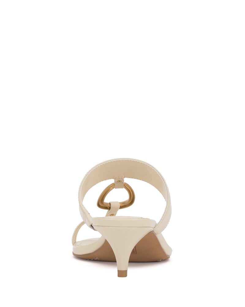 Rear view of the Vince Camuto Kimena O-Ring Kitten Heel Sandal in beige, showcasing a toe loop and stylish gold O-ring detail on the strap, set on an elegant kitten heel against a white background.