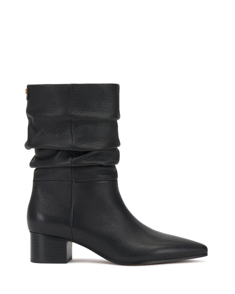 The Kuvania Bootie by Vince Camuto is shown in profile against a white background, featuring a single black leather ankle boot with a low block heel, slouched shaft, and almond-shaped toe.