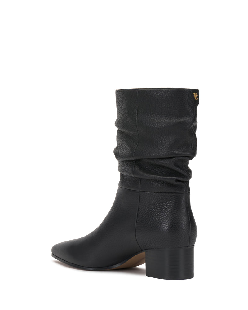 The Kuvania Bootie by Vince Camuto is a black, mid-calf leather boot featuring a chunky low heel and a slightly slouched shaft, shown from the back.