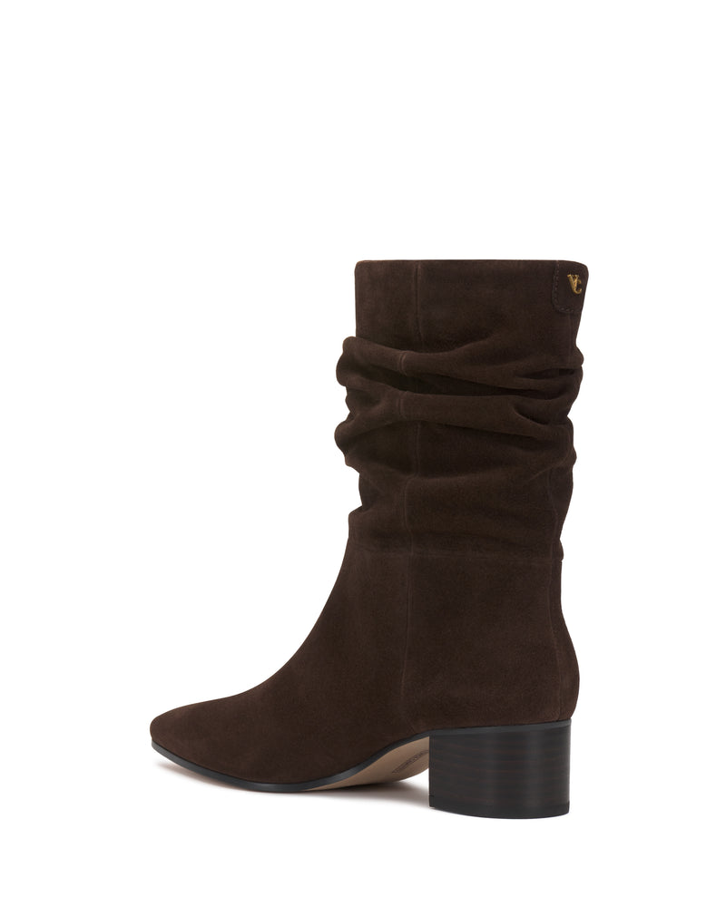 The Kuvania Bootie by Vince Camuto is a dark brown suede mid-calf boot featuring a slouchy shaft and a chunky black heel, shown in a side view on a white background.
