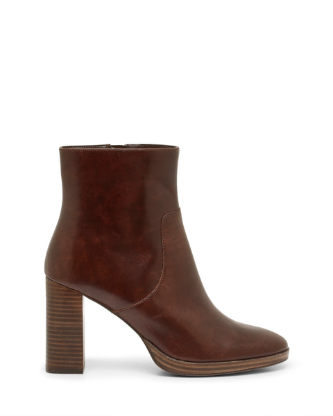 The Vince Camuto Laylei Bootie is a brown leather, ankle-high shoe featuring a rounded toe and a tall, stacked block heel. It showcases a smooth finish with a side zipper for easy wear and is displayed against a white background.