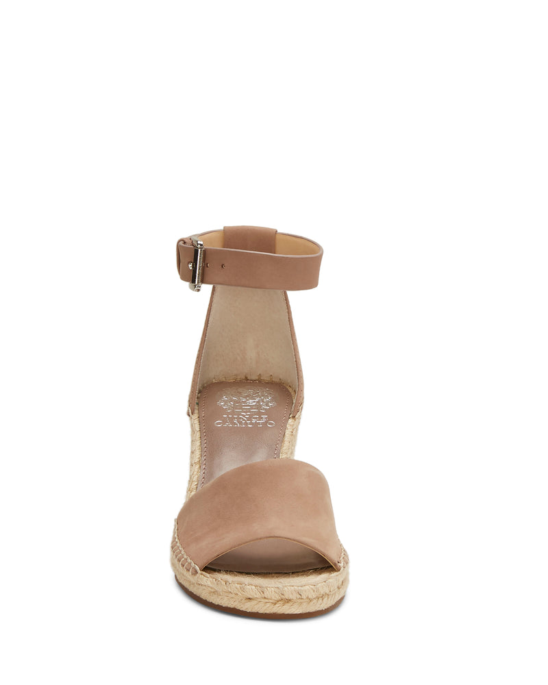 Front view of the Leera Espadrille Wedge Sandal by Vince Camuto in tan, featuring an ankle strap, open toe, and woven jute sole against a white background.