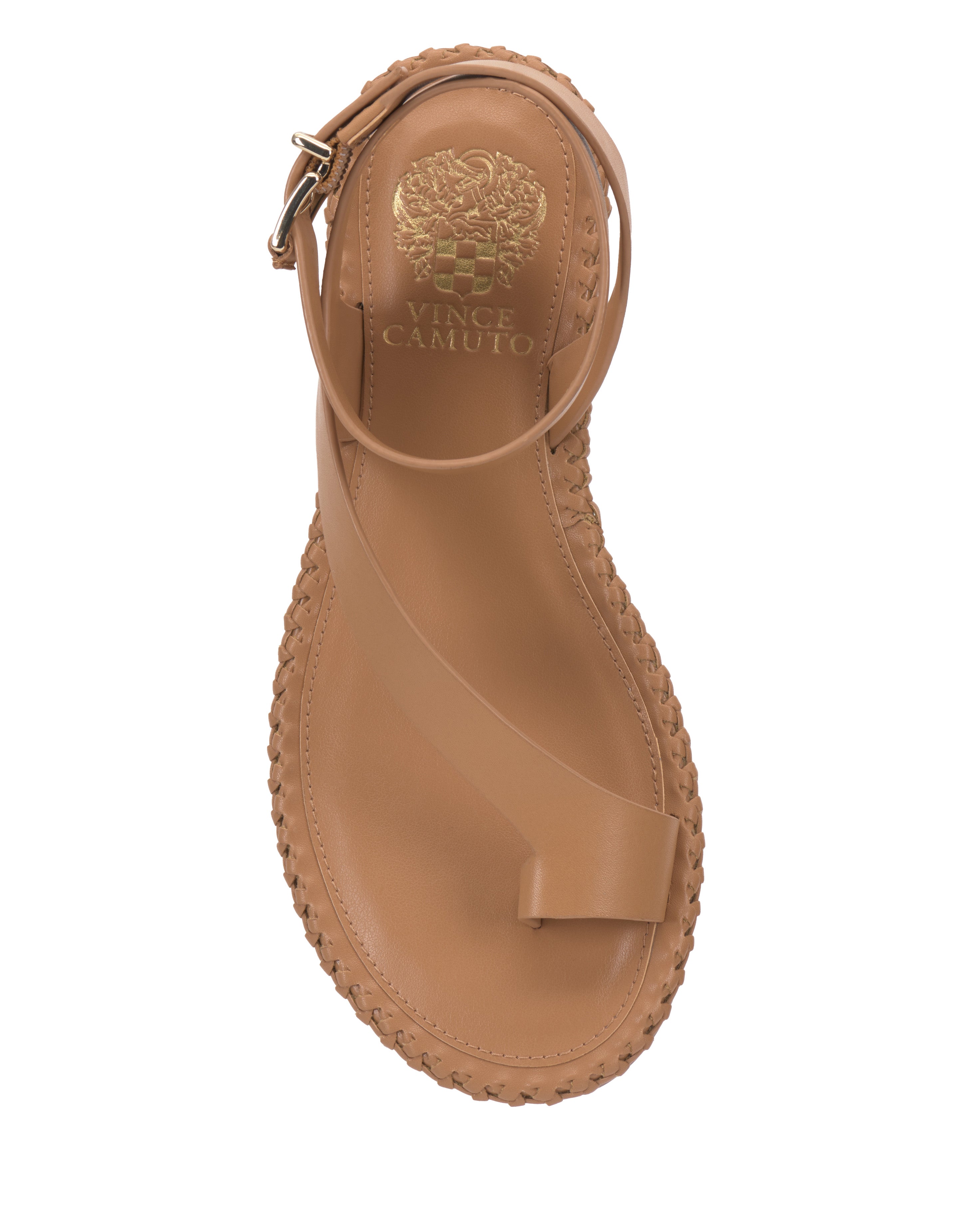Top view of the Vince Camuto Libahs Sandal in tan, a modern flat with an asymmetrical design, toe loop, angled strap, braided edge accents, and gold logo on the insole.